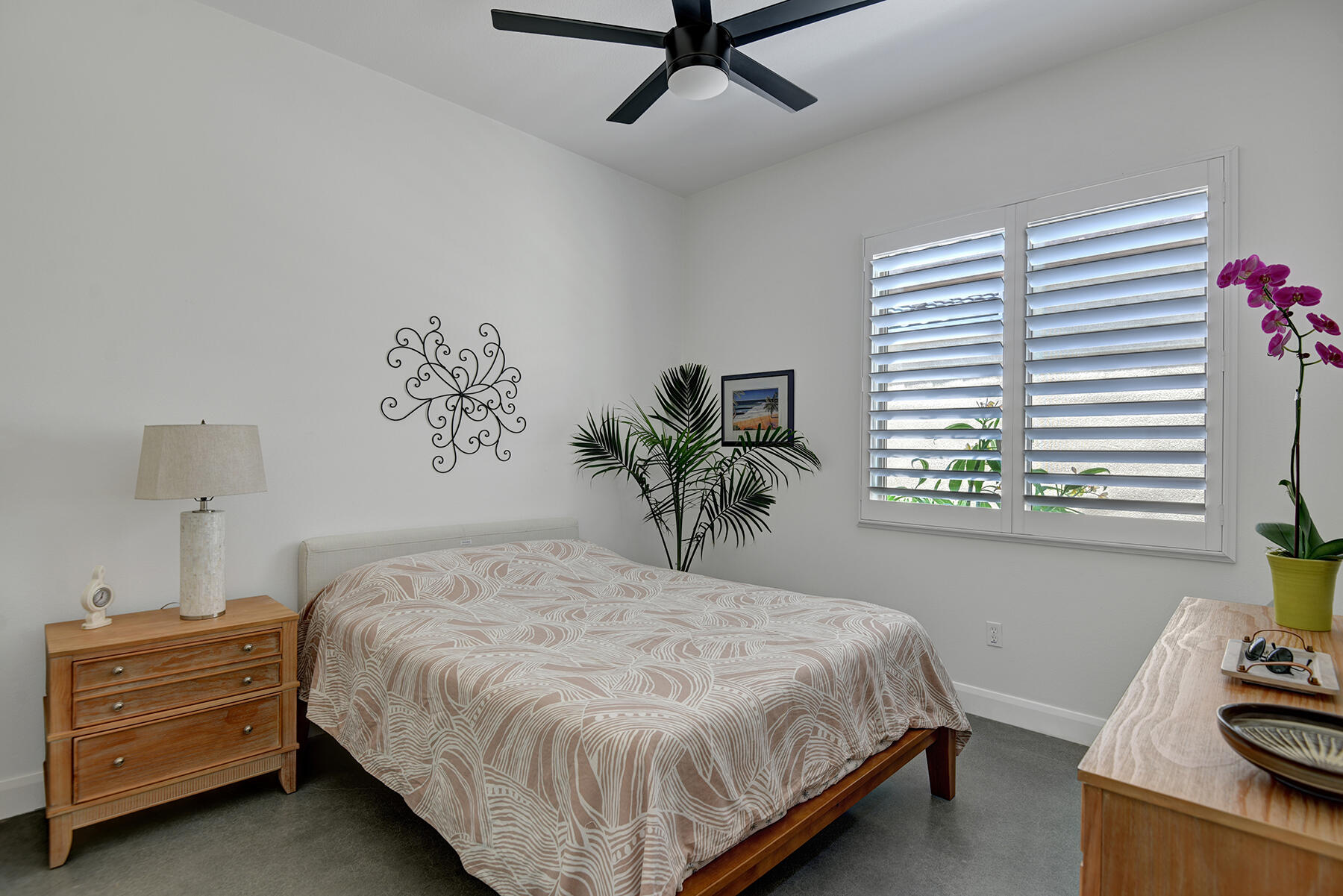 81881 Avenida Estuco Indio, CA 92203 - Photo 15 of 33 a bedroom with a bed and a window