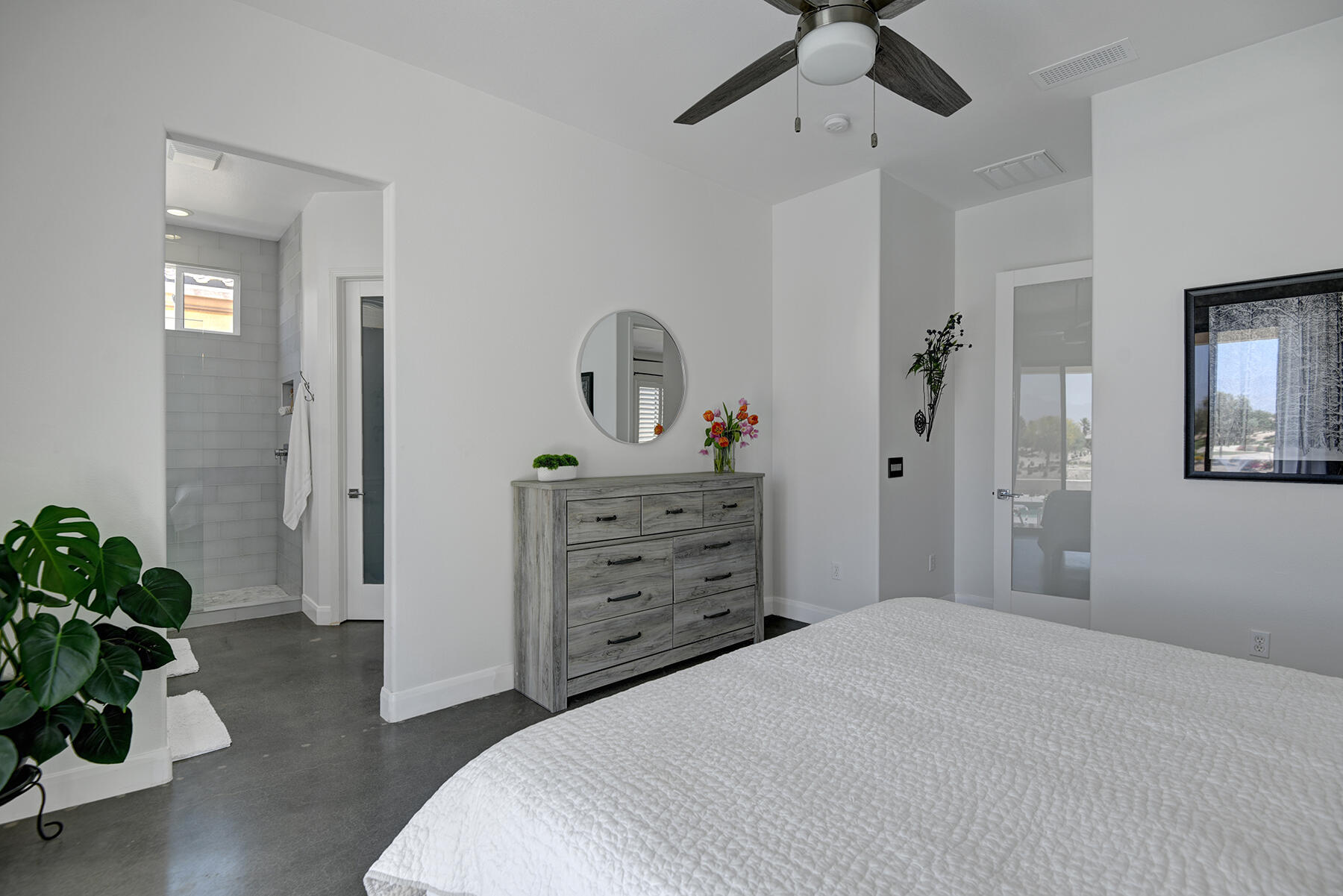 81881 Avenida Estuco Indio, CA 92203 - Photo 20 of 33 a bedroom with a bed and a potted plant