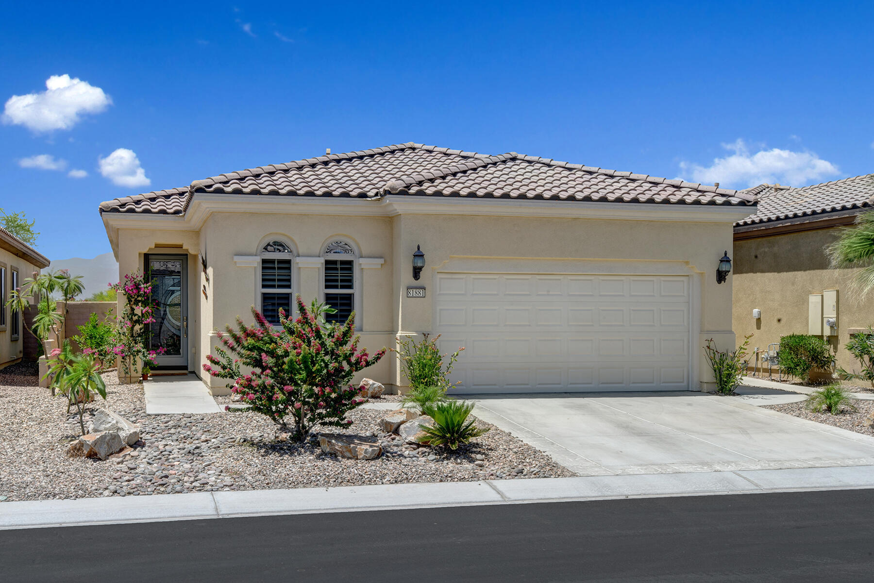 81881 Avenida Estuco Indio, CA 92203 - Photo 2 of 33 a front view of a house with garden