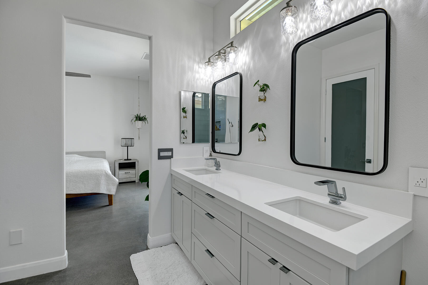 81881 Avenida Estuco Indio, CA 92203 - Photo 21 of 33 a en suite bathroom with a double vanity sink and mirror