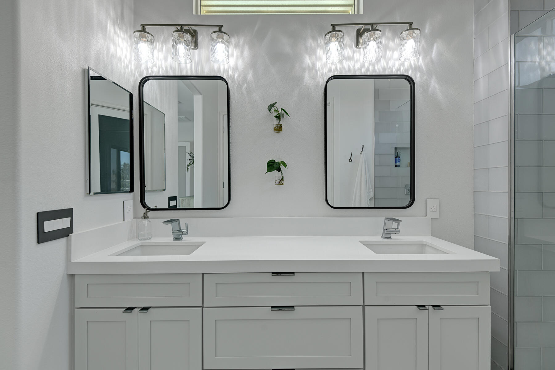 81881 Avenida Estuco Indio, CA 92203 - Photo 22 of 33 a bathroom with double vanity sinks and a mirror