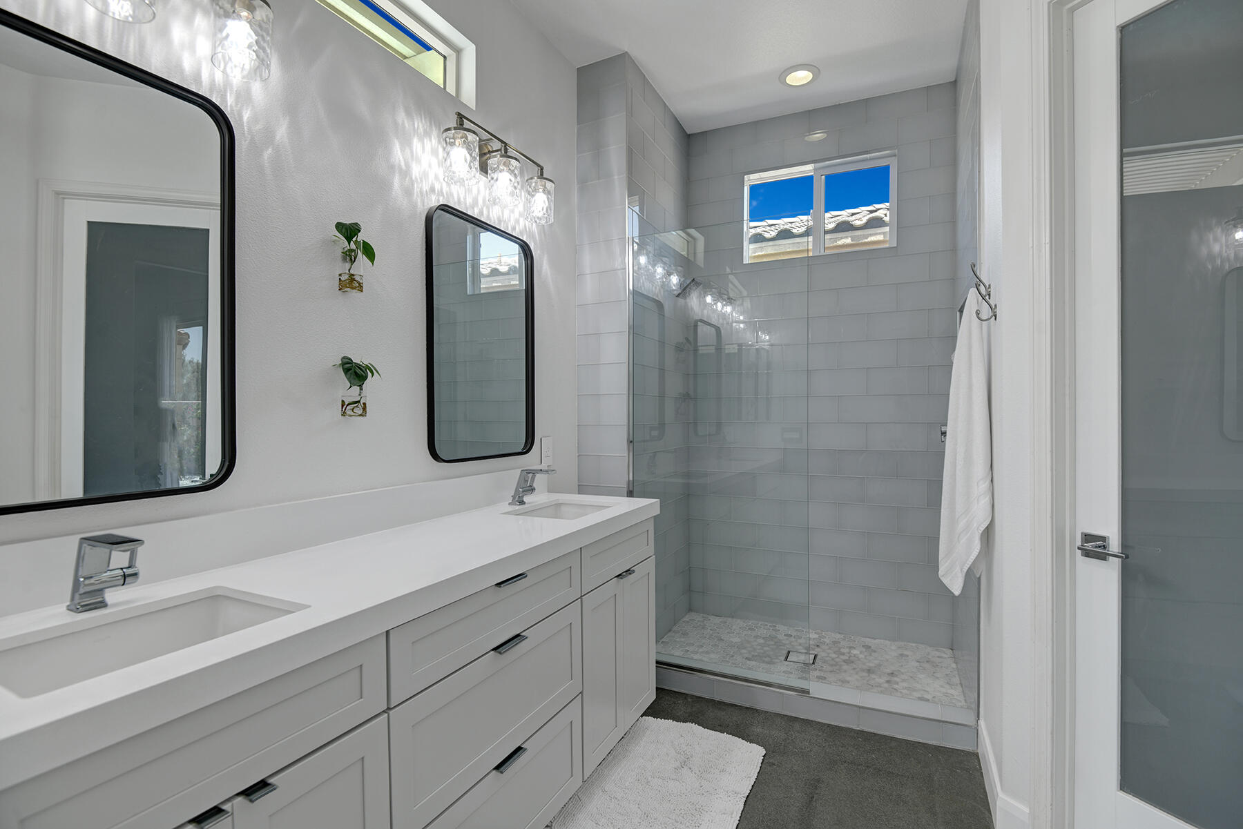 81881 Avenida Estuco Indio, CA 92203 - Photo 23 of 33 a bathroom with a double vanity sink mirror and shower