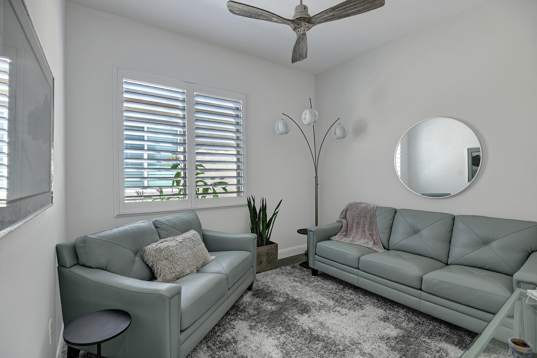81881 Avenida Estuco Indio, CA 92203 - Photo 25 of 33 a living room with furniture and a large window