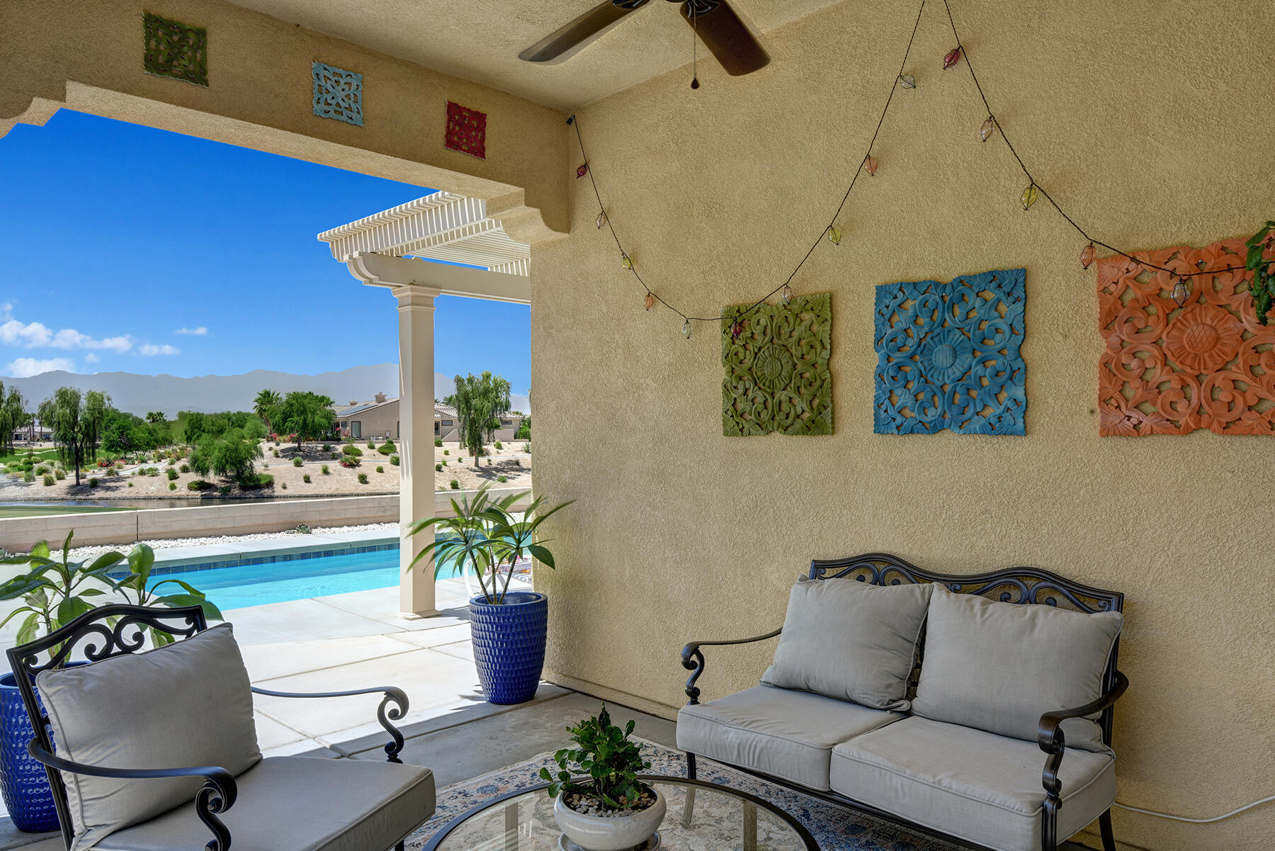 81881 Avenida Estuco Indio, CA 92203 - Photo 29 of 33 a living room with furniture and a potted plant