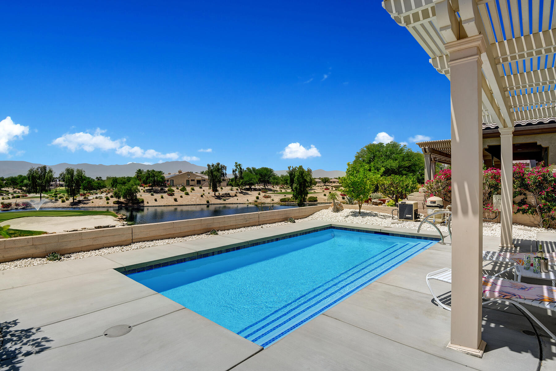 81881 Avenida Estuco Indio, CA 92203 - Photo 30 of 33 a view of a terrace with swimming pool and outdoor seating