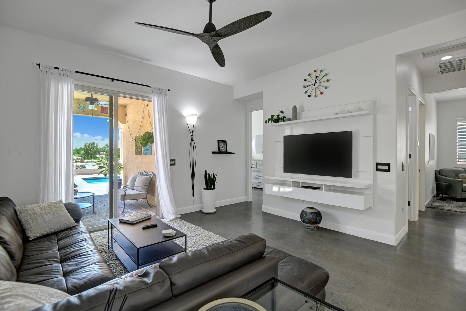 81881 Avenida Estuco Indio, CA 92203 - Photo 5 of 33 a living room with furniture and a flat screen tv