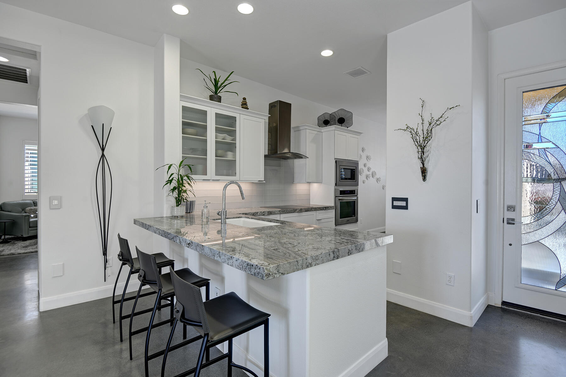 81881 Avenida Estuco Indio, CA 92203 - Photo 6 of 33 a kitchen with a table and chairs