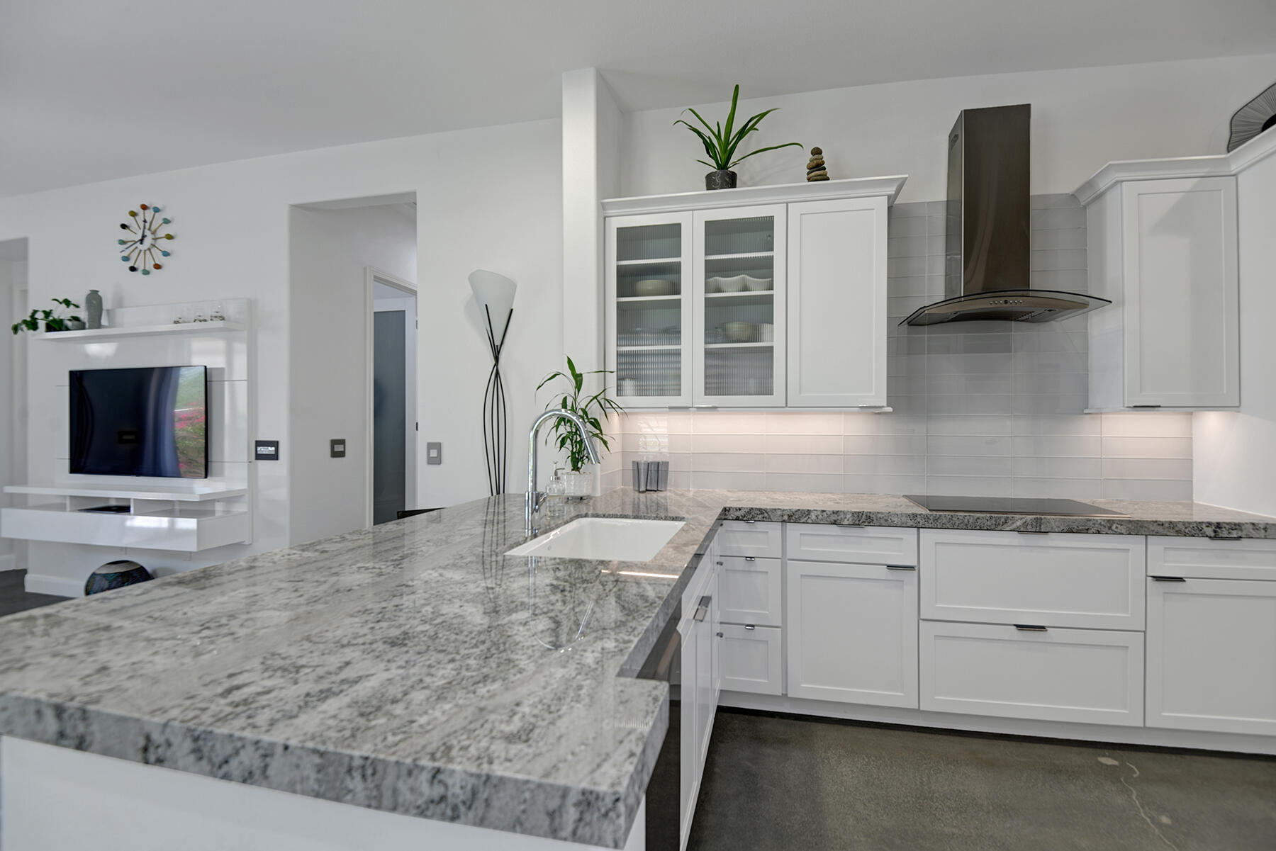 81881 Avenida Estuco Indio, CA 92203 - Photo 7 of 33 a kitchen with granite countertop a sink a stove and cabinets