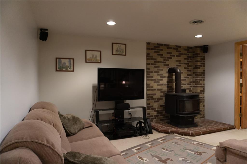 153 Sunken Valley Road Rural Valley, PA 16249 - Photo 11 of 22 finished basement with wood burning stove