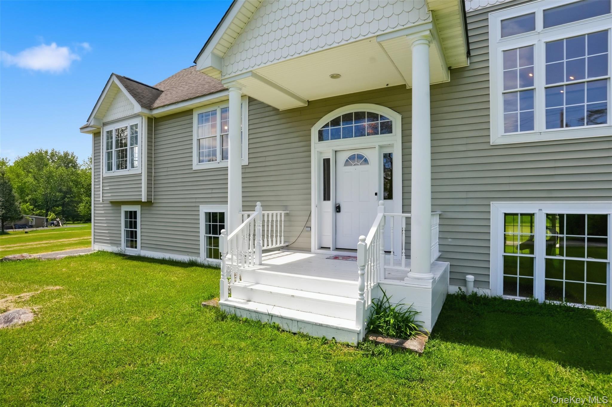 160 Pirog Road Pine Bush, NY 12566 - Photo 5 of 50 a front view of a house with a garden and yard