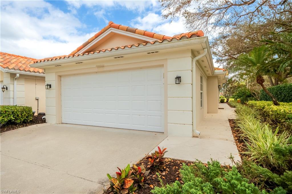 3695 El Segundo Court Naples, FL 34109 - Photo 7 of 37 Garage featuring driveway