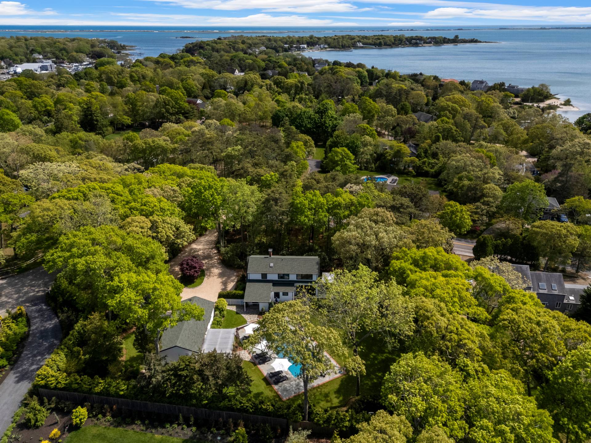 91 East Tiana Road Hampton Bays, NY 11946 - Photo 23 of 46 a view of a lake with a house