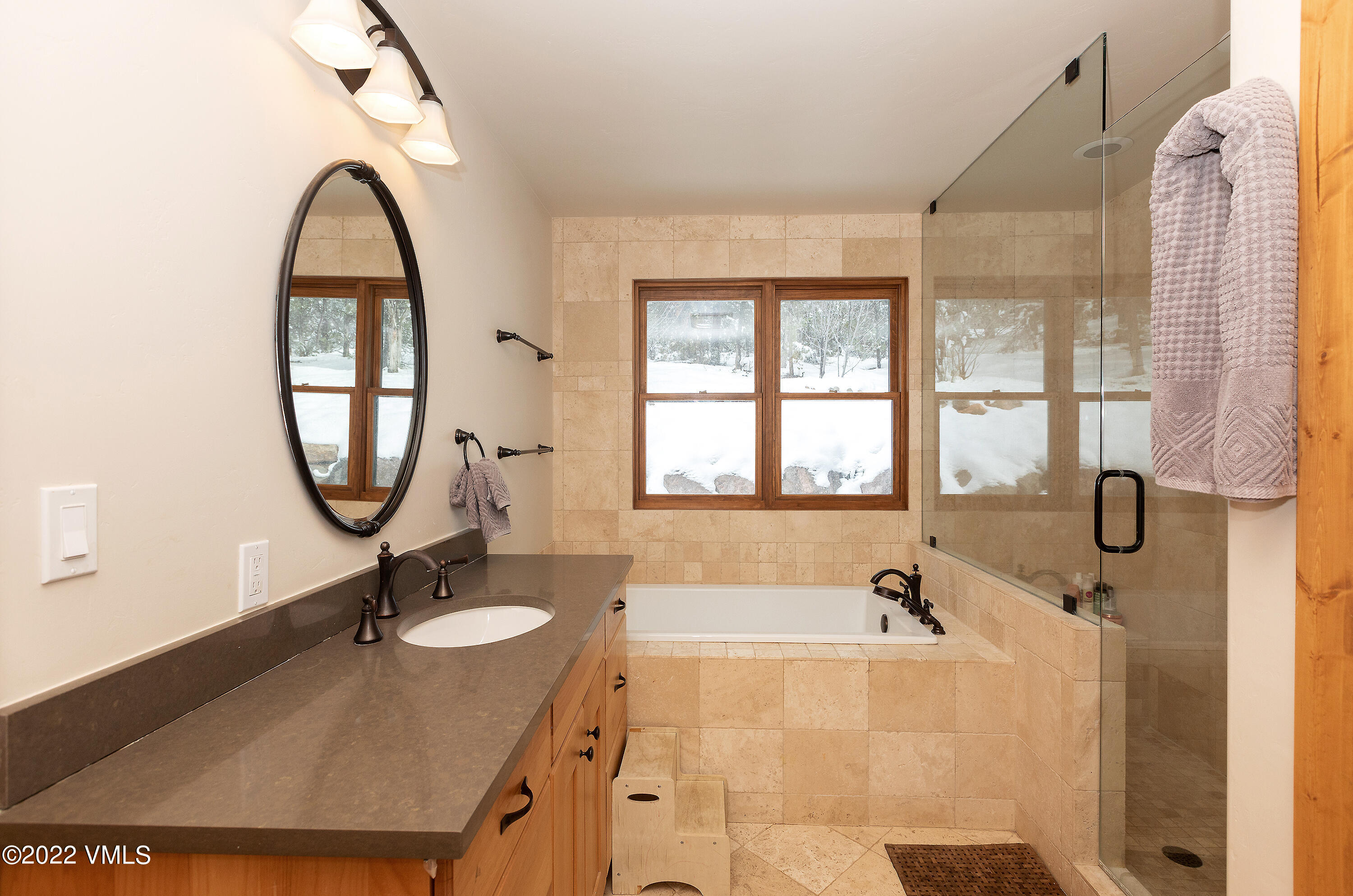 2025 Eby Creek Road Eagle, CO 81631 - Photo 15 of 40 a bathroom with a tub sink and mirror