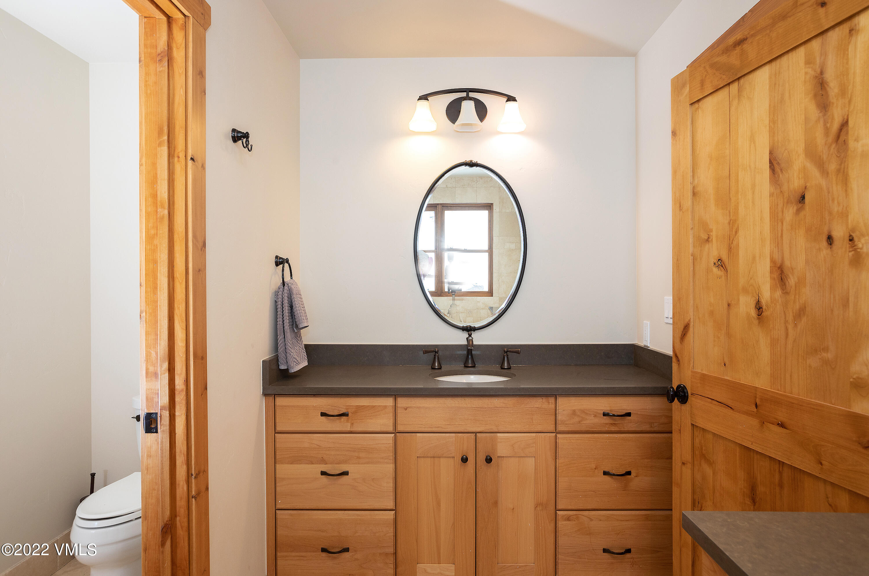 2025 Eby Creek Road Eagle, CO 81631 - Photo 17 of 40 a bathroom with a granite countertop sink and a mirror