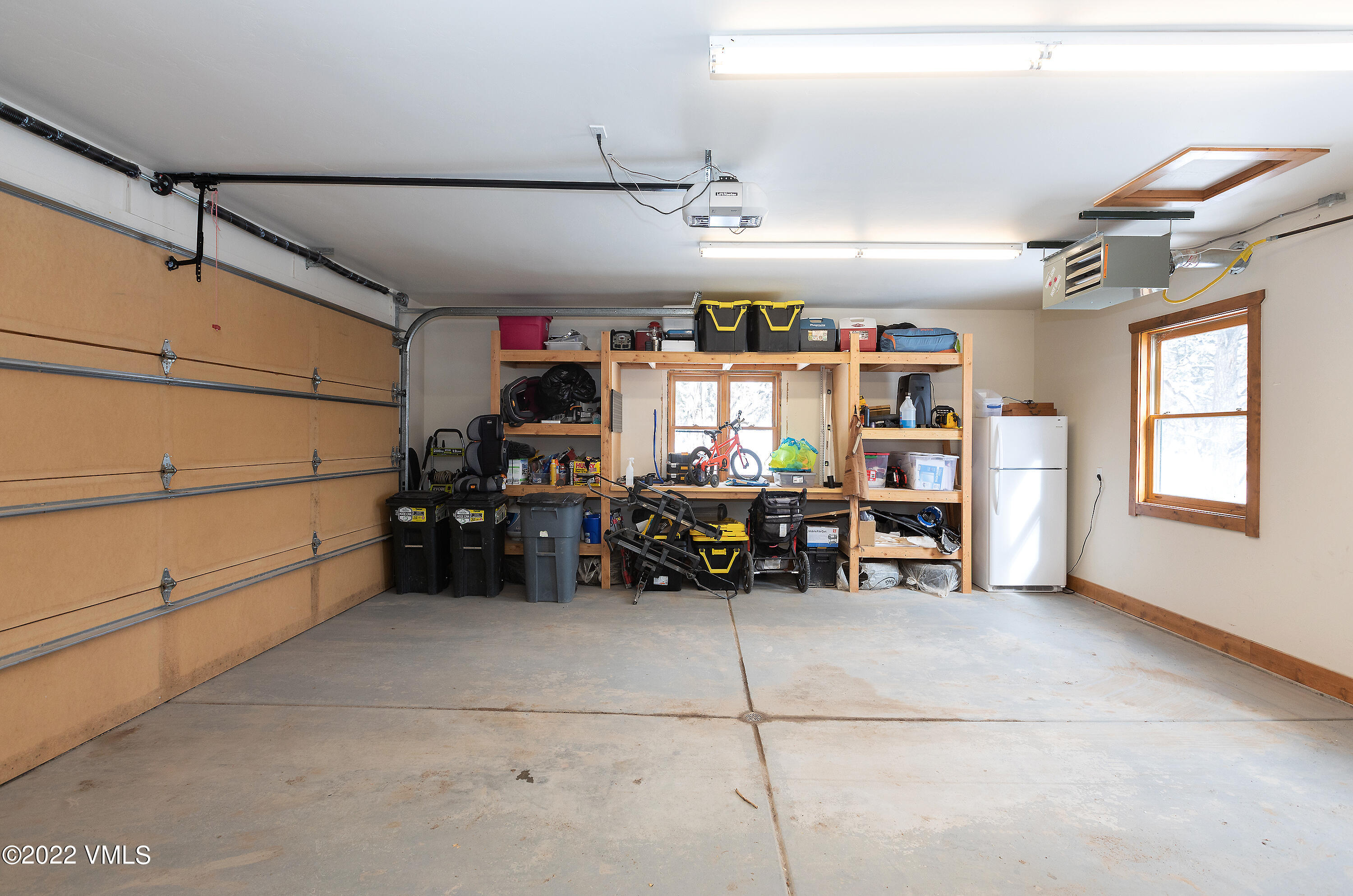 2025 Eby Creek Road Eagle, CO 81631 - Photo 27 of 40 a garage with a car and furniture
