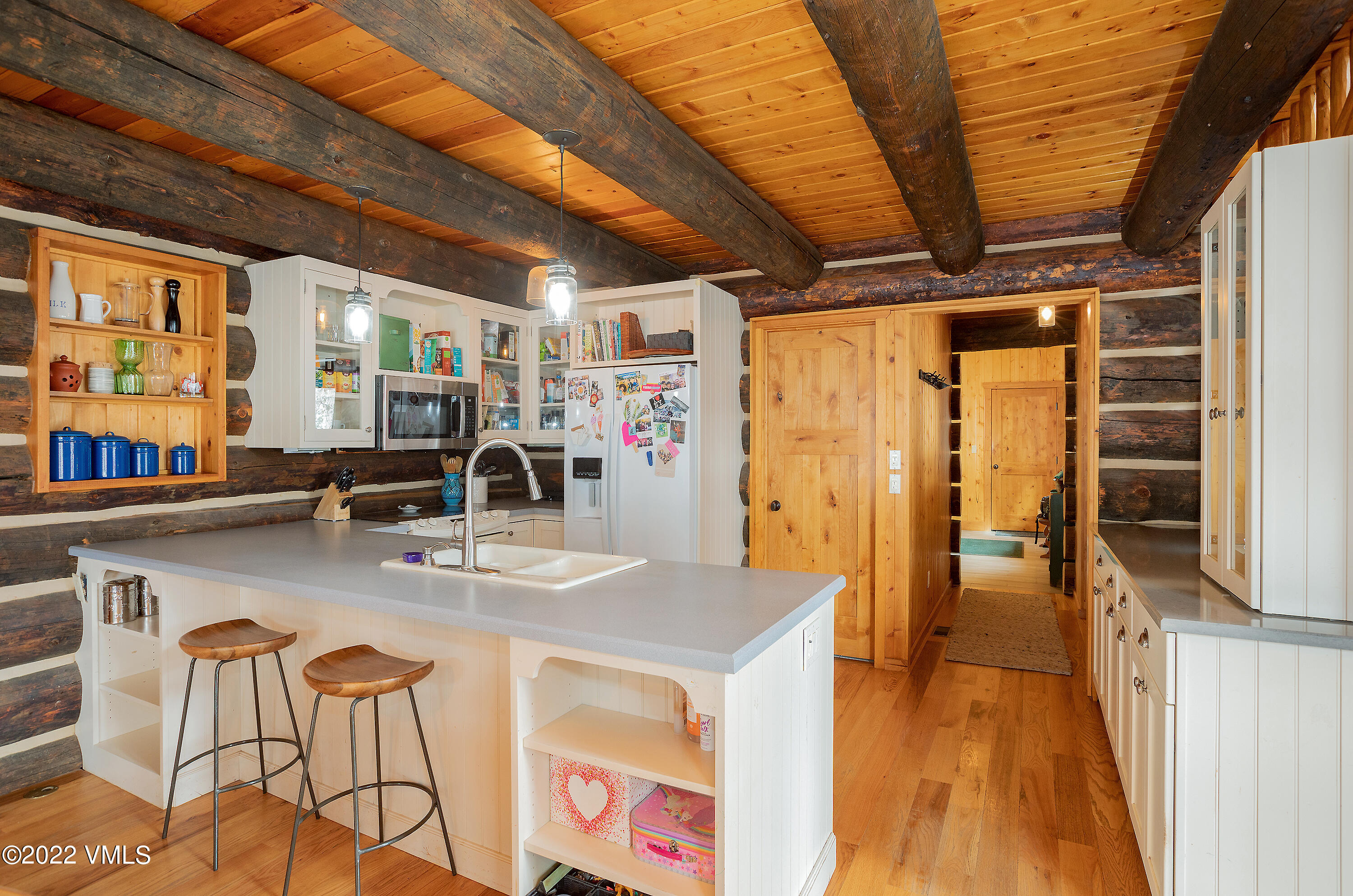 2025 Eby Creek Road Eagle, CO 81631 - Photo 8 of 40 a very nice looking dining room with kitchen island granite countertop a table chairs and a chandelier
