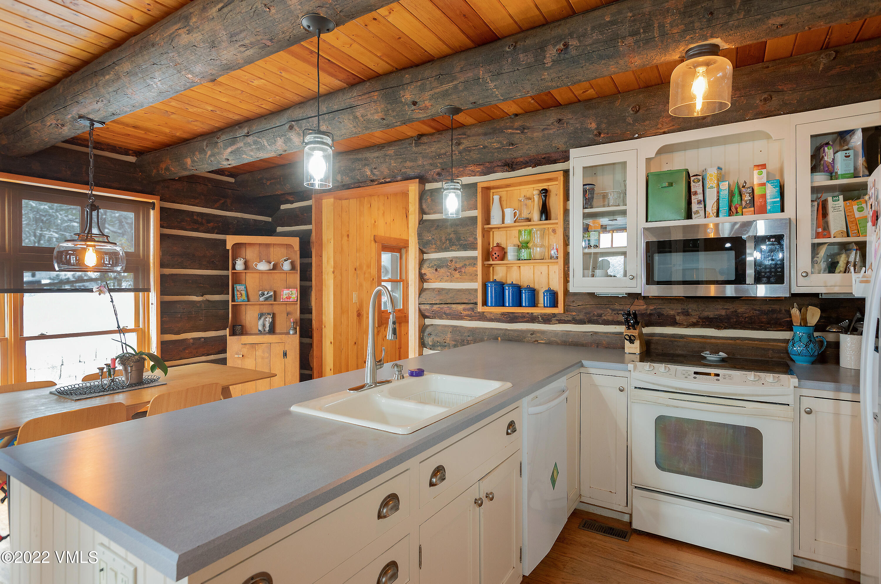 2025 Eby Creek Road Eagle, CO 81631 - Photo 9 of 40 a kitchen with stainless steel appliances granite countertop a stove and cabinets