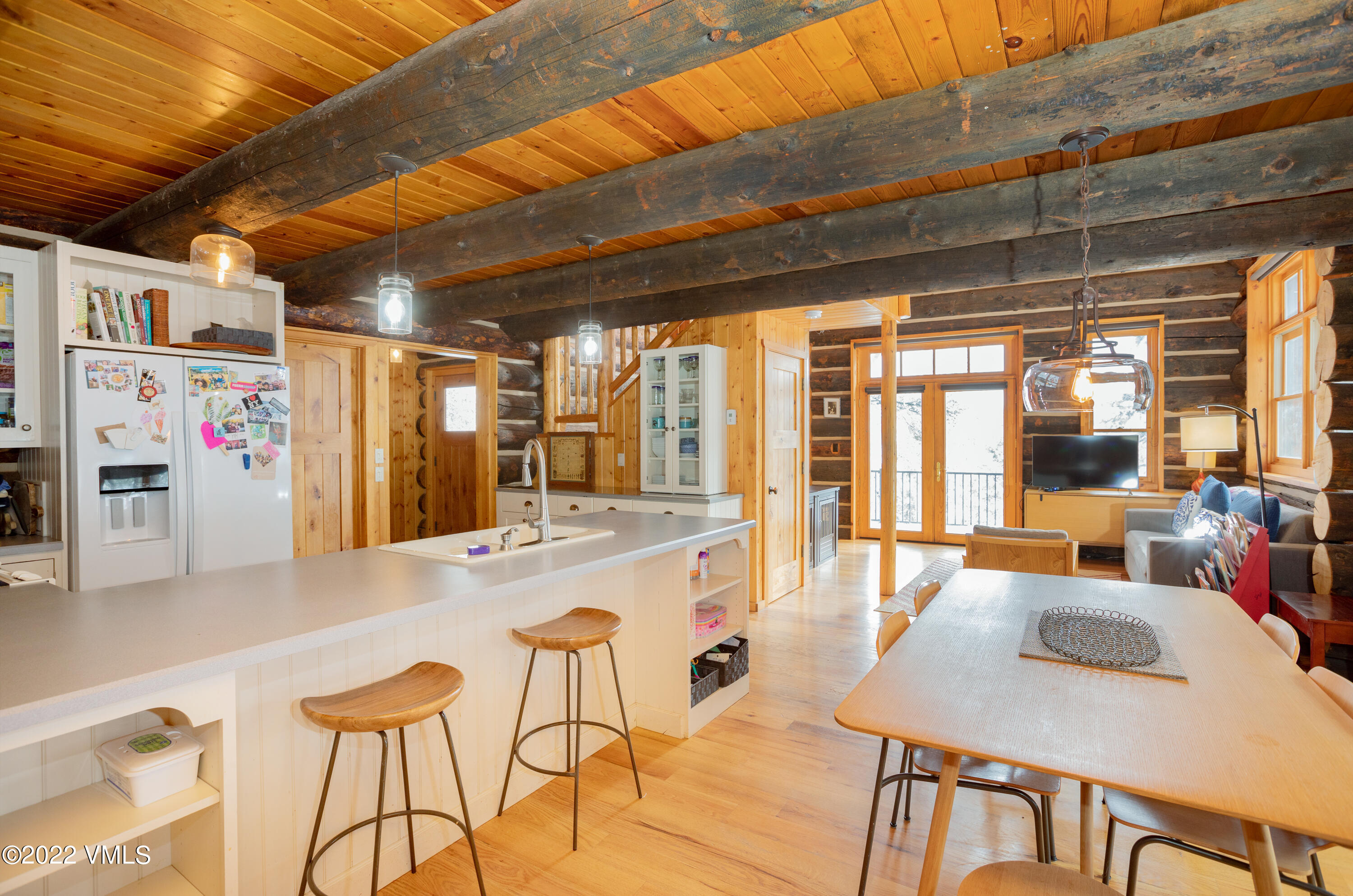 2025 Eby Creek Road Eagle, CO 81631 - Photo 10 of 40 a dining hall with stainless steel appliances granite countertop a stove a refrigerator a dining table and chairs with the kitchen view