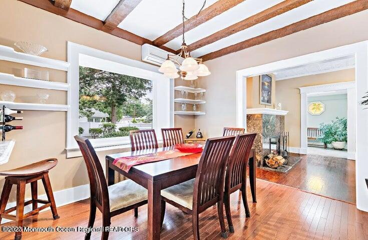 214 Cliftwood Road Oakhurst, NJ 07755 - Photo 13 of 61 a dining room with furniture a chandelier and wooden floor