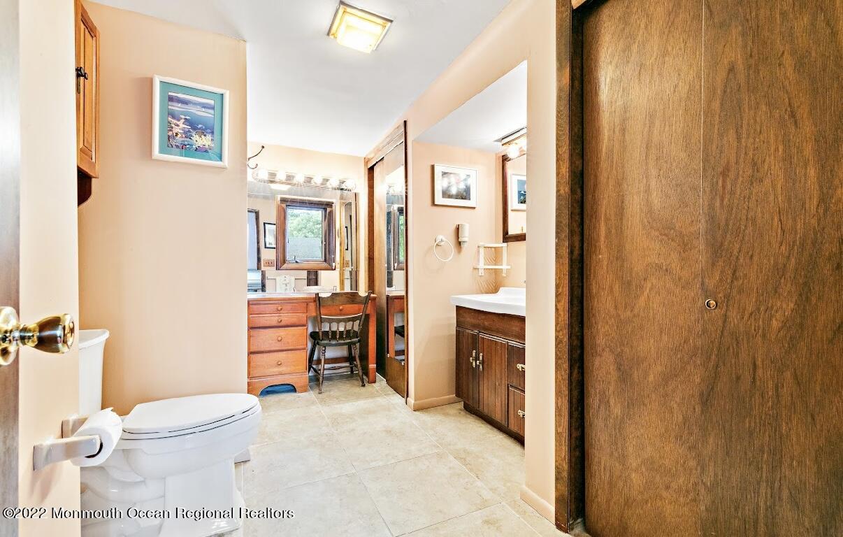 214 Cliftwood Road Oakhurst, NJ 07755 - Photo 27 of 61 a bathroom with a toilet a sink and a shower