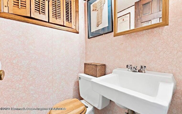 214 Cliftwood Road Oakhurst, NJ 07755 - Photo 30 of 61 a bathroom with a sink and a toilet