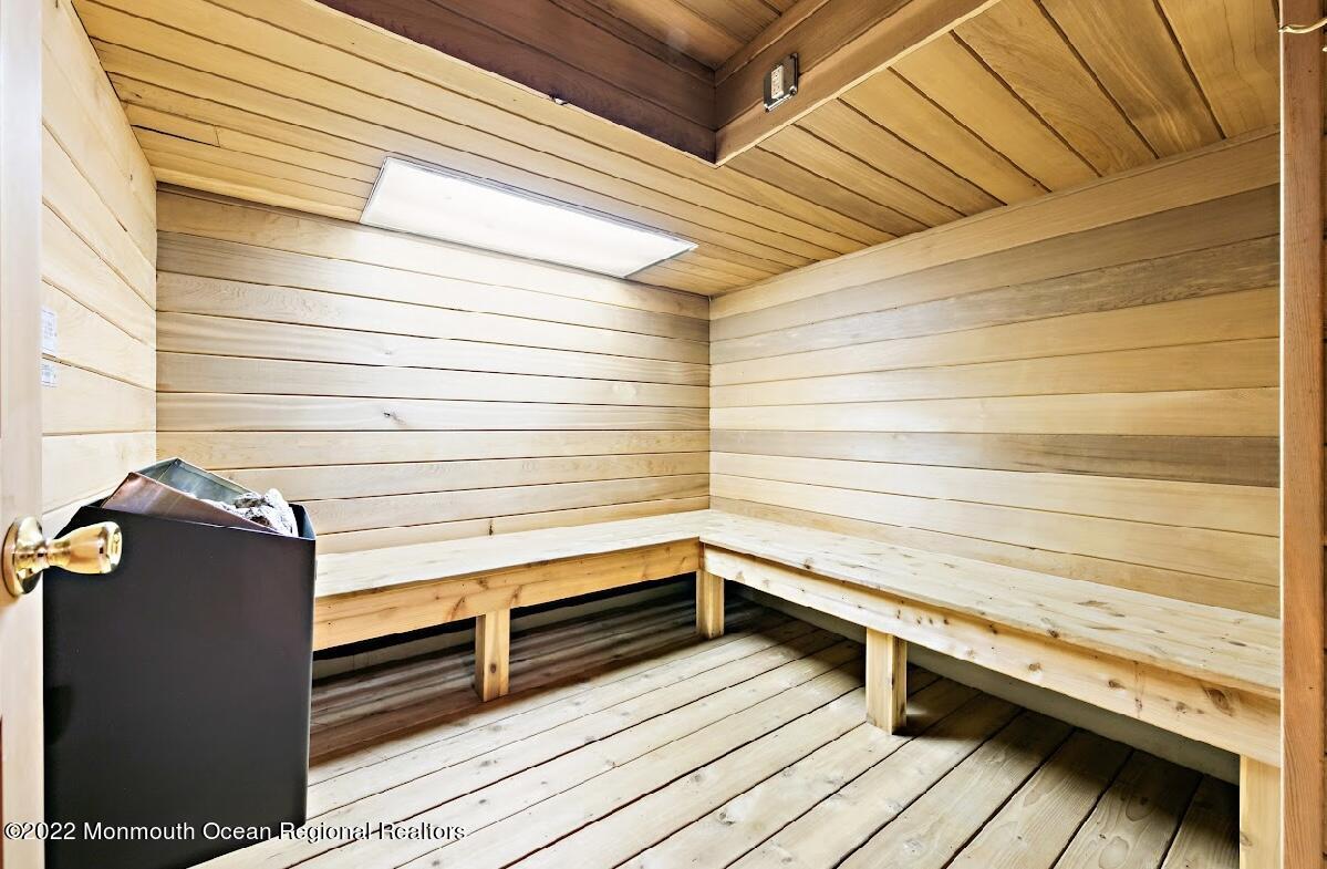 214 Cliftwood Road Oakhurst, NJ 07755 - Photo 41 of 61 a view of a balcony with two chair and a barbeque