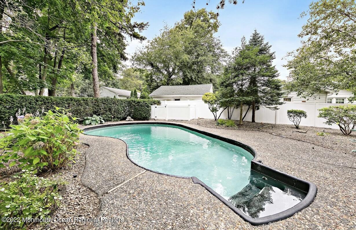 214 Cliftwood Road Oakhurst, NJ 07755 - Photo 57 of 61 a view of a swimming pool with a balcony