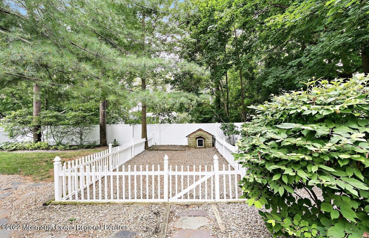 214 Cliftwood Road Oakhurst, NJ 07755 - Photo 59 of 61 a view of a house with a small yard and wooden fence