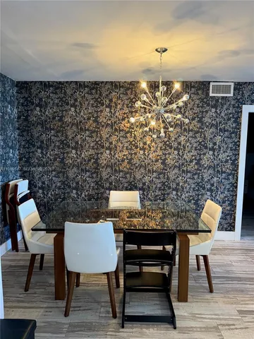 a view of a workspace with furniture