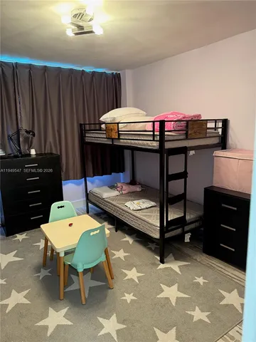 a bedroom with a bed and furniture