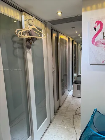 a view of a hallway with windows