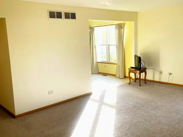 a kitchen with a refrigerator and a stove