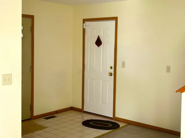 a stove top oven sitting inside of a kitchen