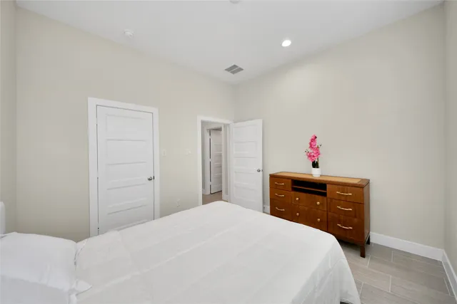 a bathroom with a sink a mirror and a shower