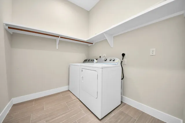 a bathroom with a granite countertop sink a toilet and a mirror