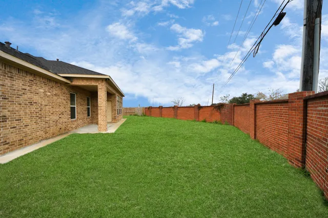 a backyard of a house with lots of green space