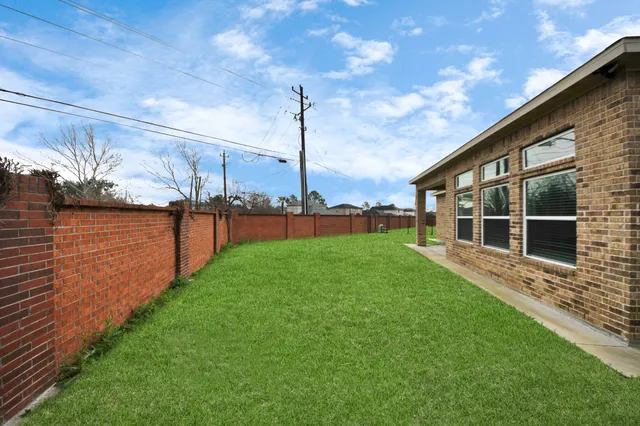 a view of a swimming pool and a yard