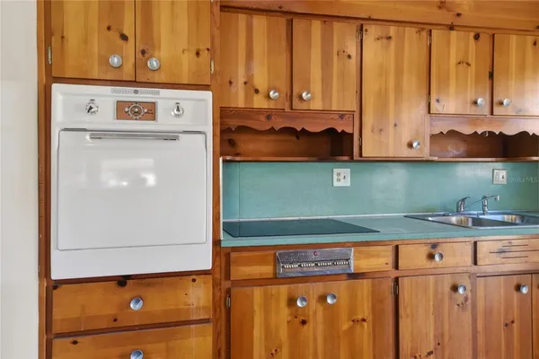a view of kitchen with wooden floor
