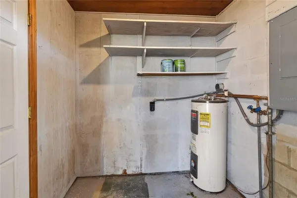 a view of a storage & utility room with racks on the wall