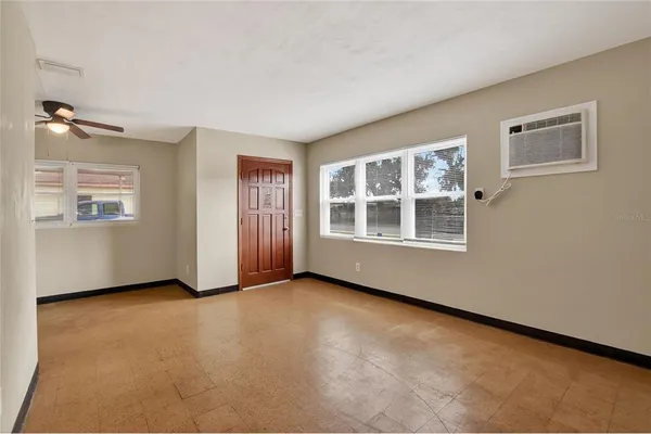 an empty room with windows