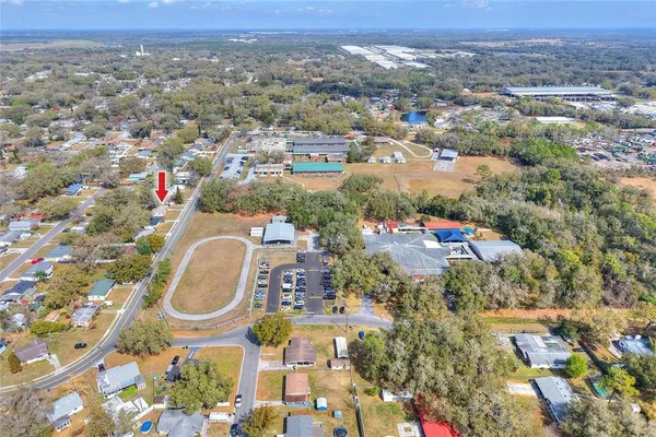 an aerial view of a house with a swimming pool