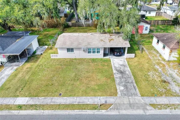 a front view of house with yard and seating area