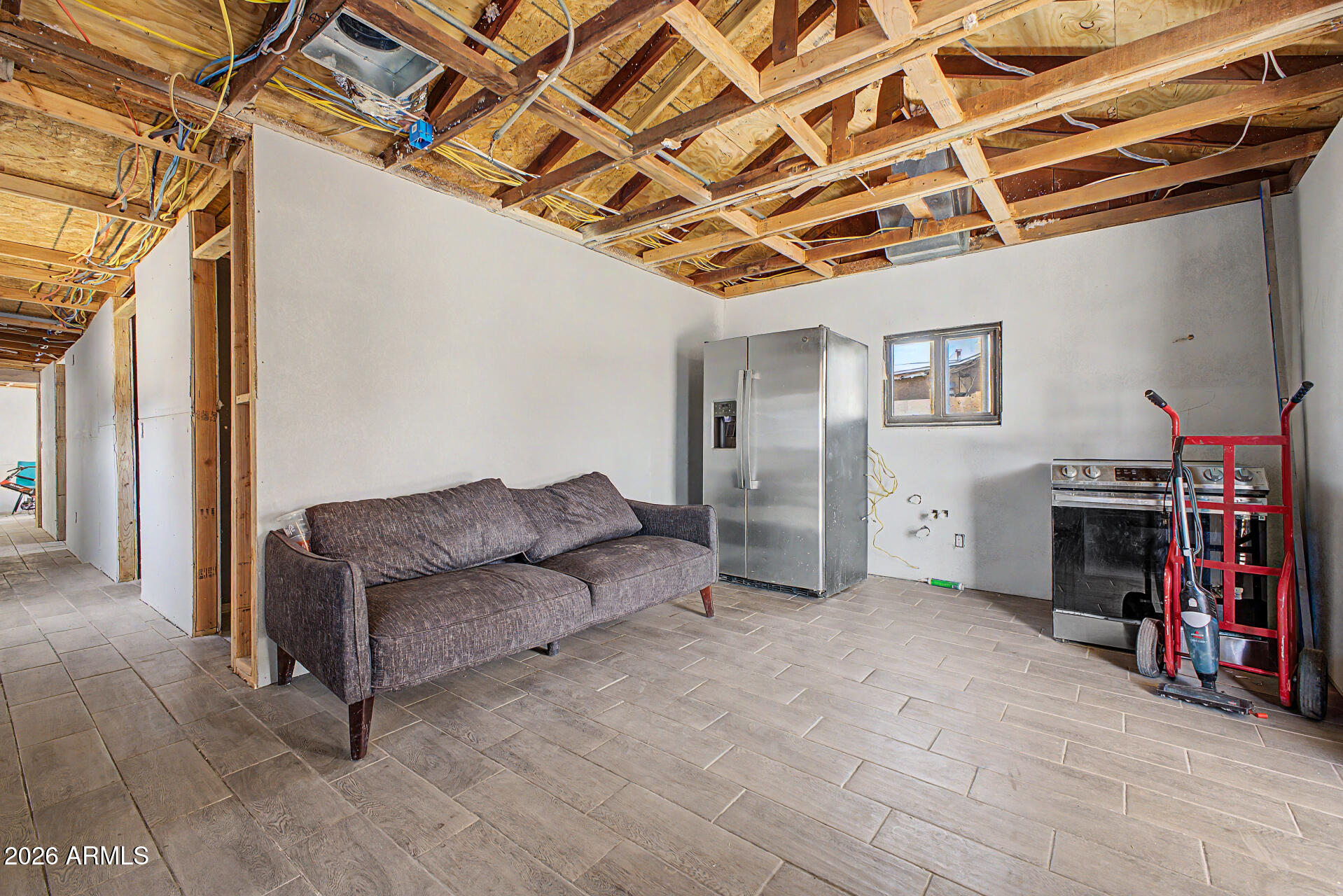 1612 South 5th Street Phoenix, AZ 85004 - Photo 5 of 27 a living room with furniture and a flat screen tv