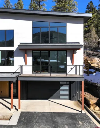 a view of kitchen with a sink and cabinets