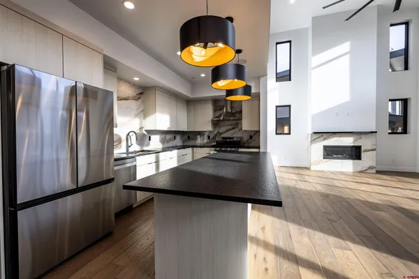 a bathroom with a glass door shower and a mirror