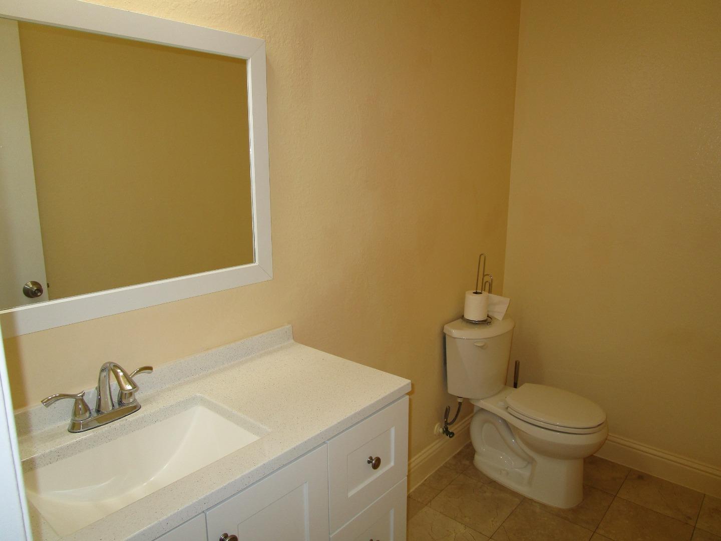 7759 Murray Avenue Gilroy, CA 95020 - Photo 6 of 11 a bathroom with a sink and a toilet