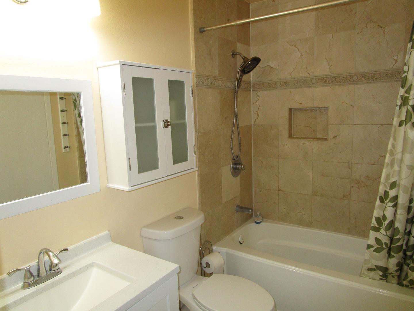 7759 Murray Avenue Gilroy, CA 95020 - Photo 8 of 11 a bathroom with a sink toilet and shower