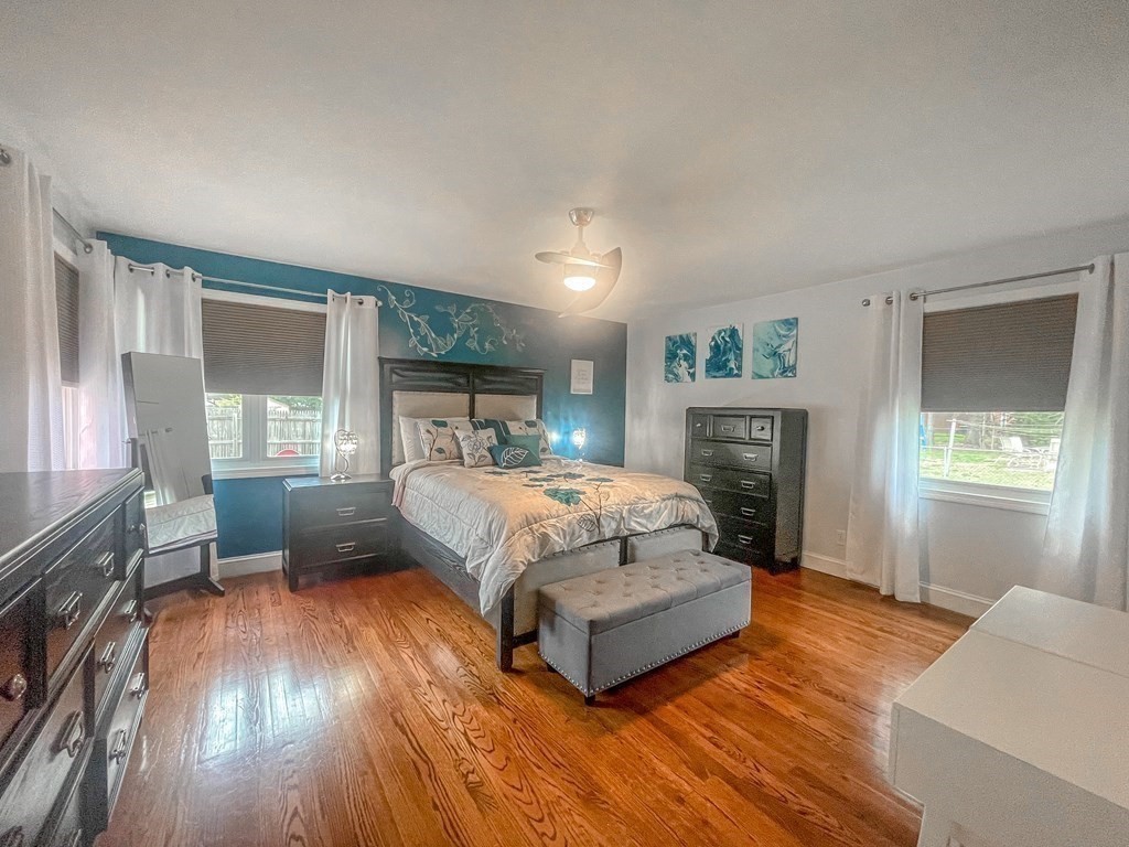 2072 Wilbraham Road Springfield, MA 01129 - Photo 12 of 22 a spacious bedroom with a bed and wooden floor