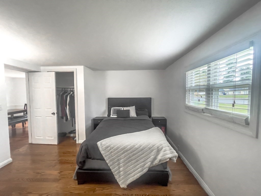 2072 Wilbraham Road Springfield, MA 01129 - Photo 15 of 22 a bedroom with a bed and a window