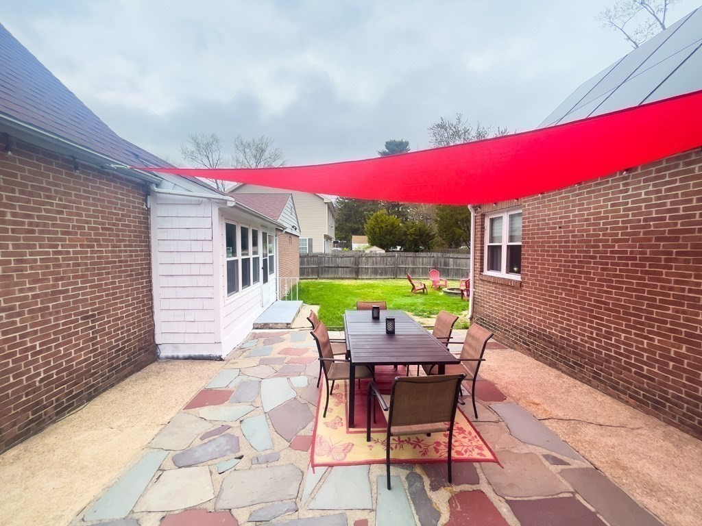 2072 Wilbraham Road Springfield, MA 01129 - Photo 4 of 22 a view of a chairs and table in backyard